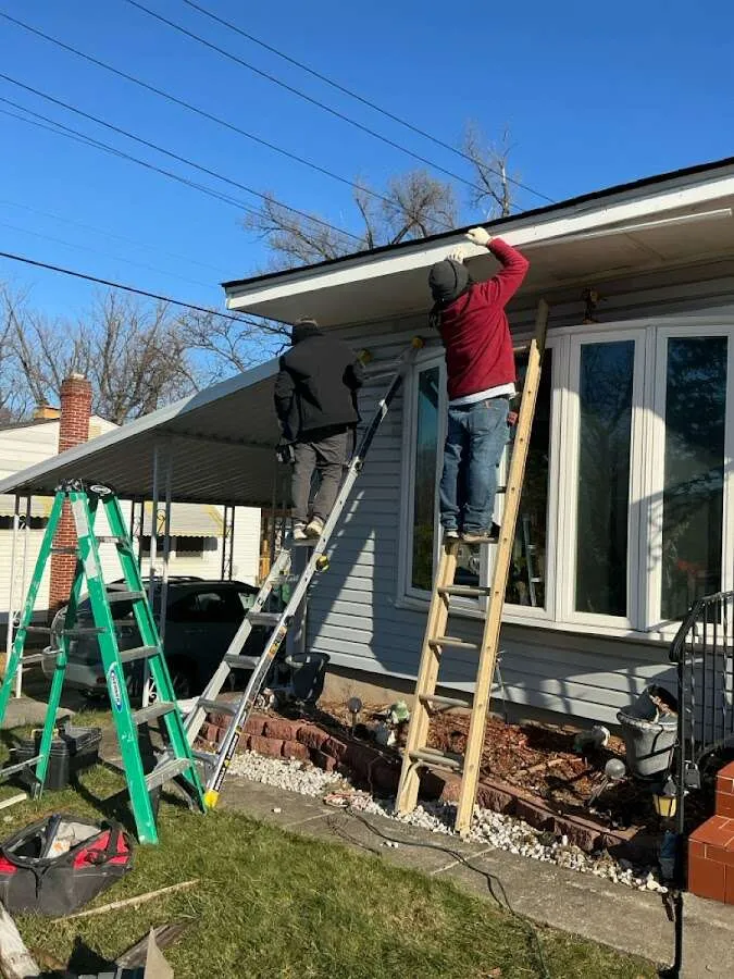 Restoration crew performing exterior repair in Olean